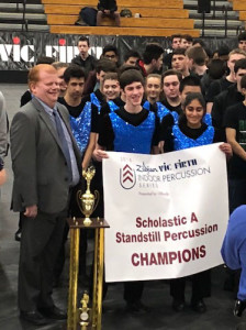 Indoor Percussionists receive the 1st Place trophy and banner at the USBands Indoor Championships